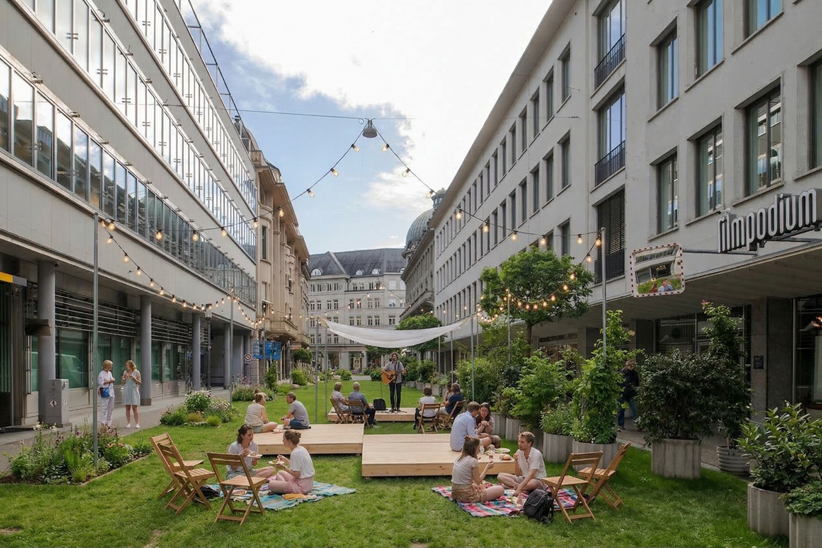 Photo — inner courtyard turned into a lawn picnic with string lights and live music